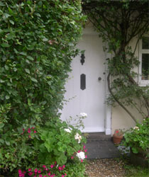 barrels by the cottage door barrels by the cottage door