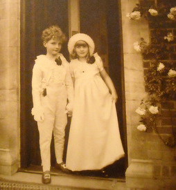 My father dressed as a page boy with an unknown bridesmaid