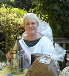 Photo: Fiona in a bee suit with smoker