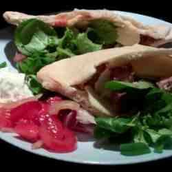Lamb filled pitta bread with haloumi and summery salads