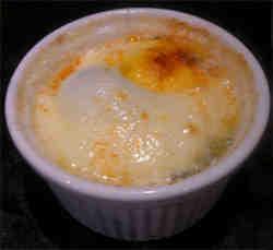 Photo of baked egg in a ramekin with a sprinkling of smoked paprika